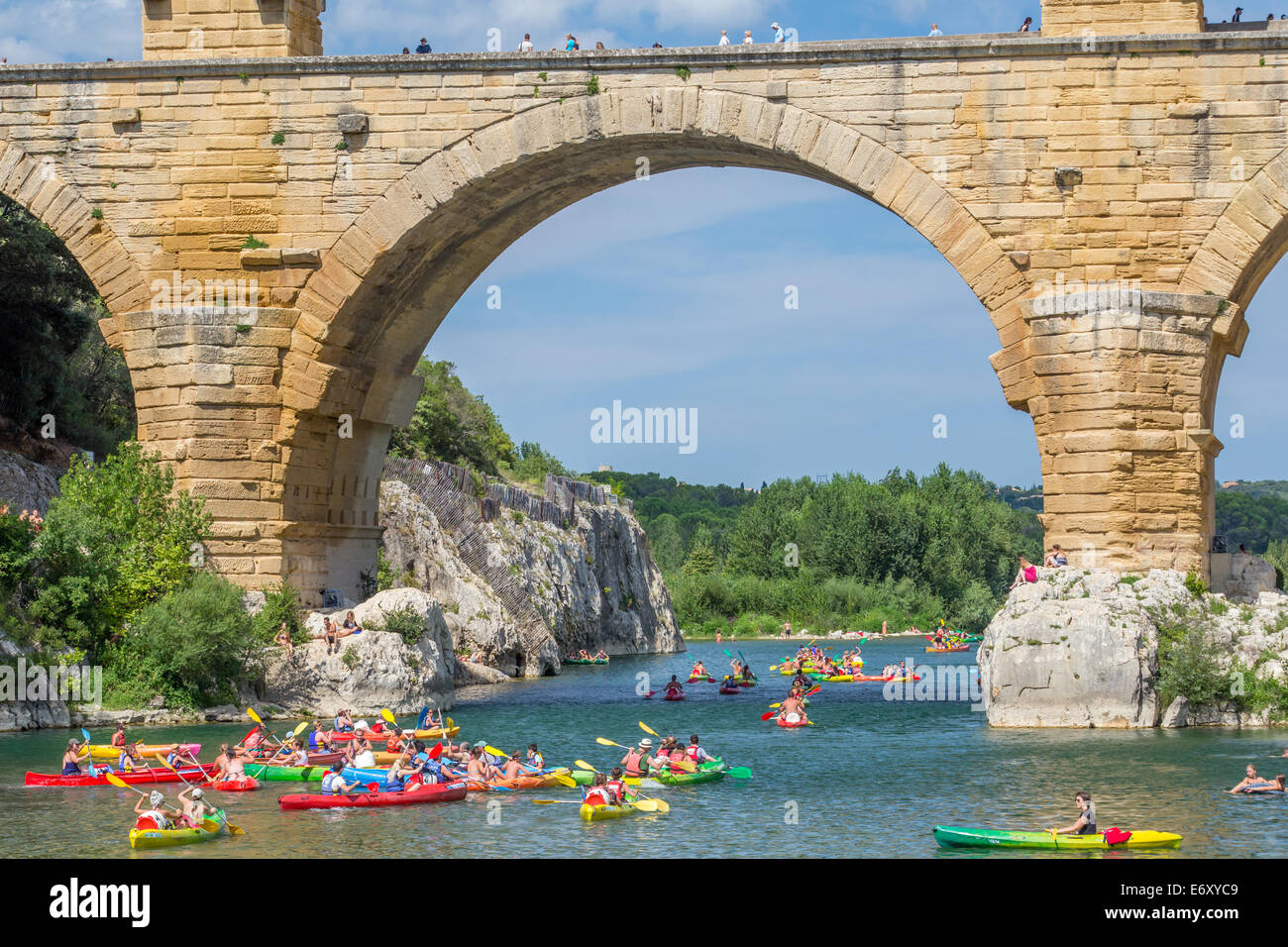 Kayaks going under the Pont du Gard Roman aqueduct, Gard, Languedoc, France Stock Photo