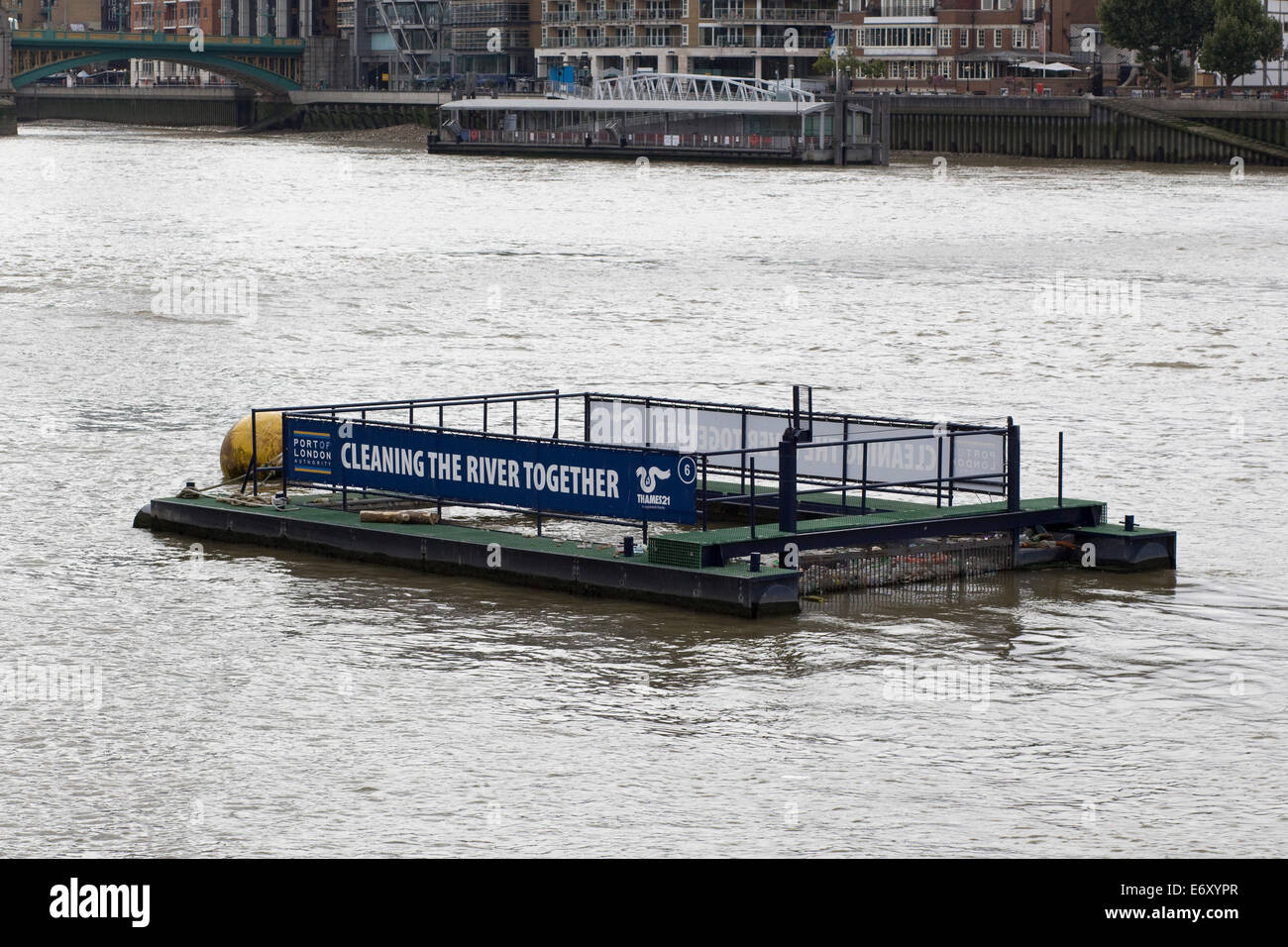 Floating barge "Cleaning the river Thames" London England Stock Photo