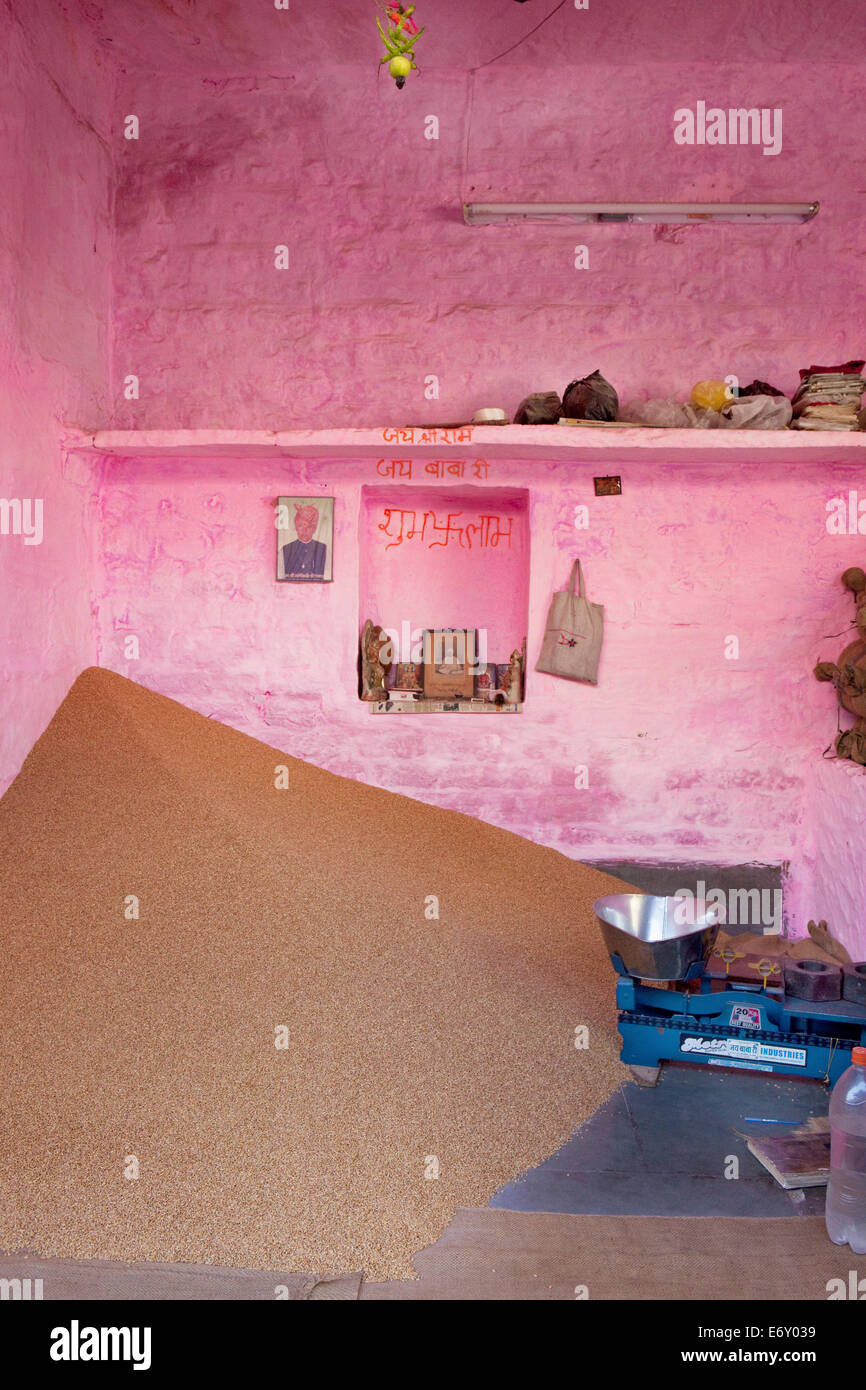 Shop selling grain with home altar, Jodhpur, Rajasthan, India Stock Photo