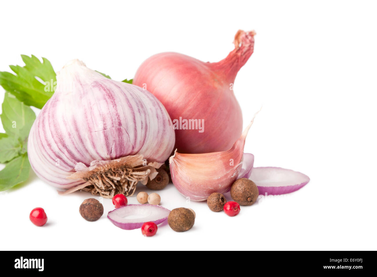 garlic and onion on white background with pepper and parsley Stock ...