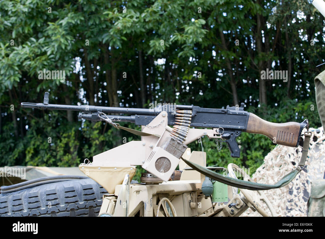 Assault Riffle with Ammunition on the top of a armored assault Vehicle Stock Photo