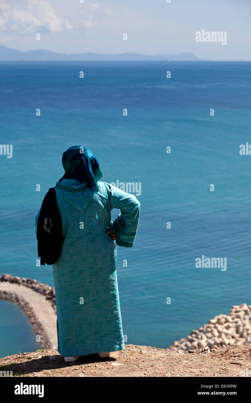 Woman looking out over the Straits of Gibraltar, Tangiers, Morocco Stock Photo