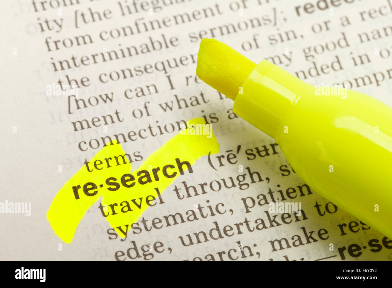 The Word Research Highlighted in Dictionary with Yellow Marker Highlighter Pen. Stock Photo