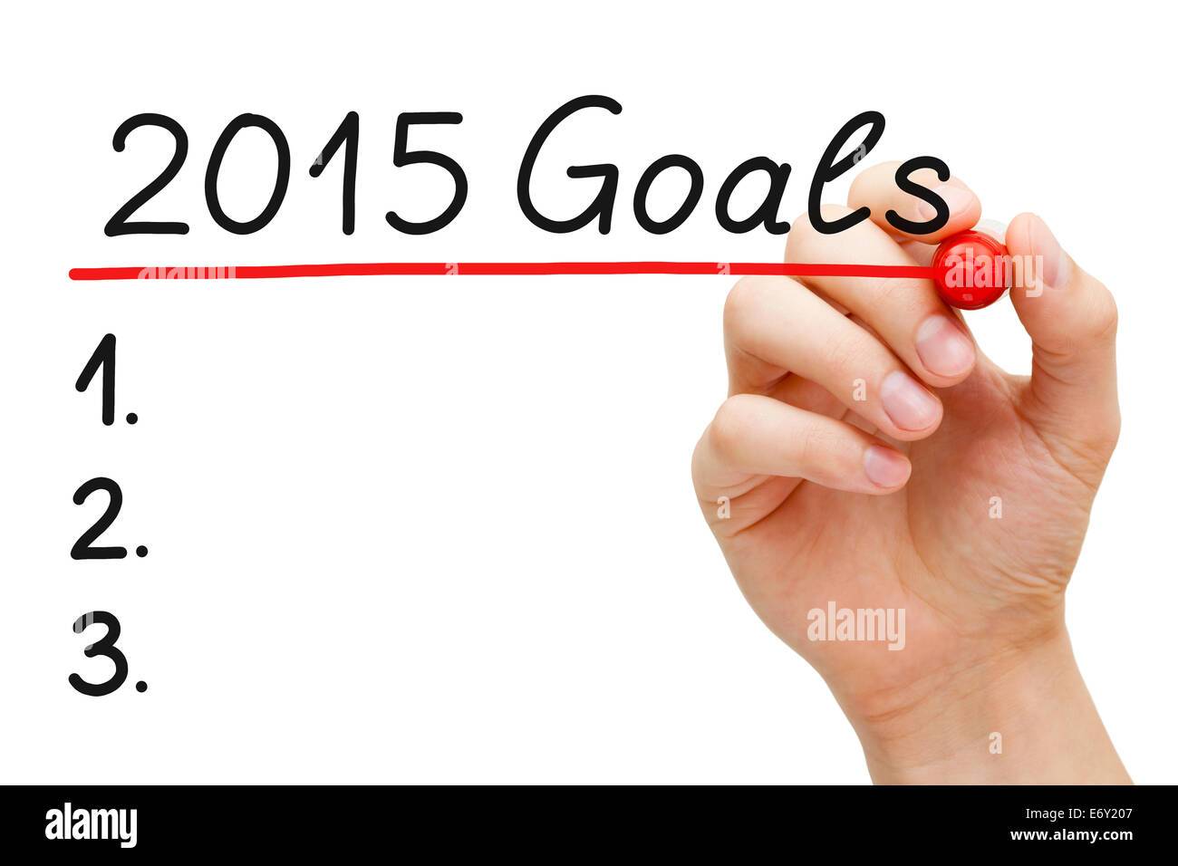 Hand underlining 2015 Goals with red marker isolated on white. Stock Photo