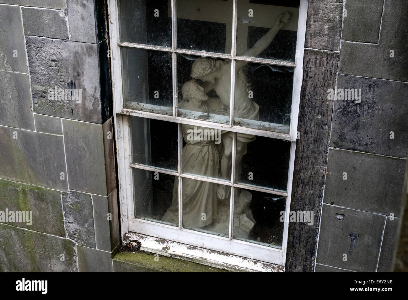 Plaster cast of Christ being taken off the cross seen through a