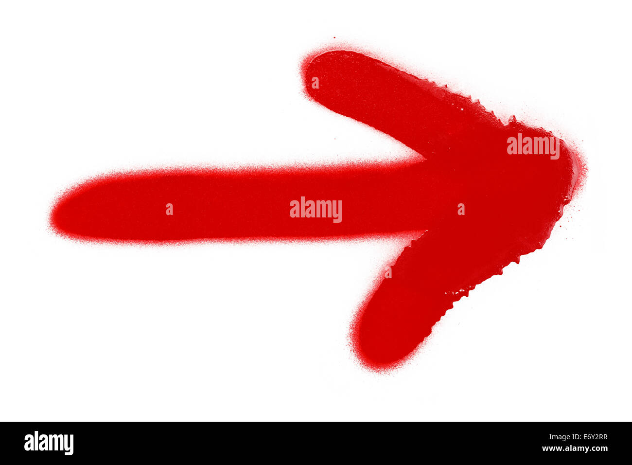 Red Spray Paint Arrow Isolated on White Background. Stock Photo