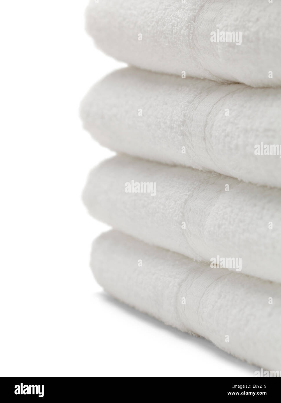 Four White Towels Isolated on White Background. Stock Photo