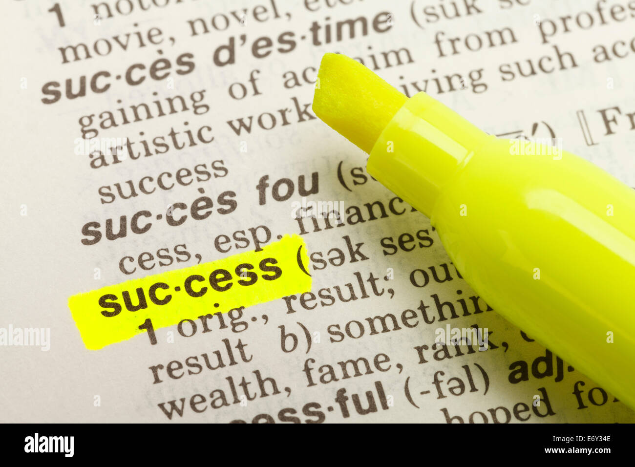 The Word Success Highlighted in Dictionary with Yellow Marker Highlighter Pen. Stock Photo