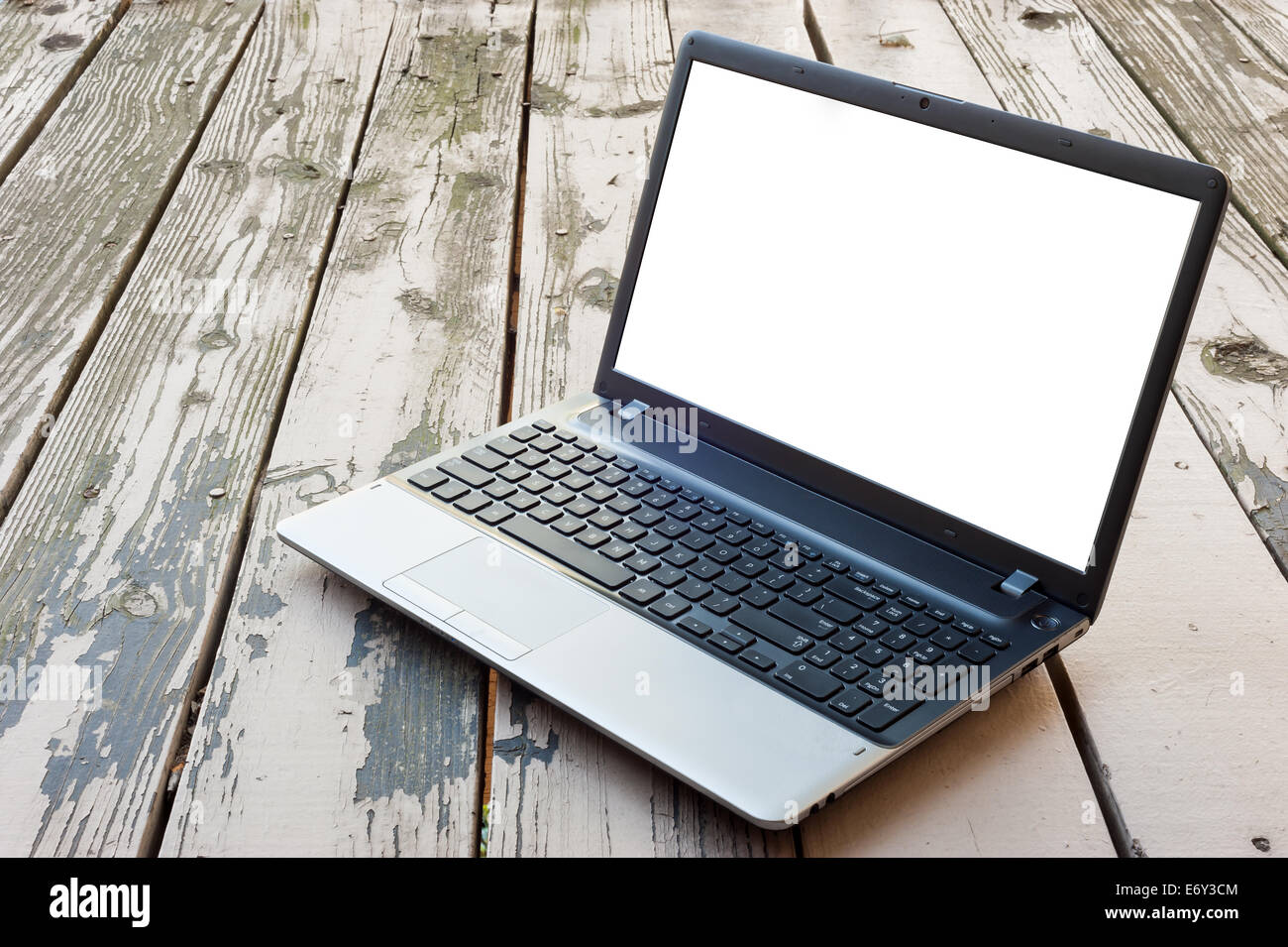 Laptop with blank screen on the wooden table Stock Photo