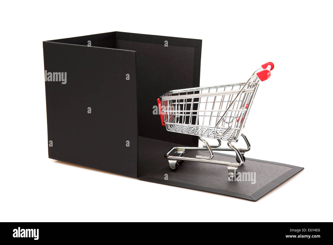 Concept shopping Cart and black gift box on a white background. Stock Photo