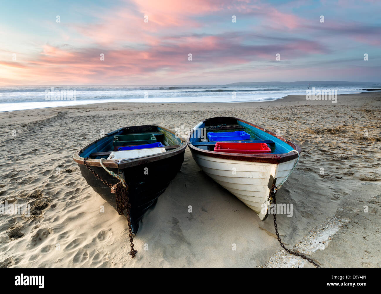 Fishing boats on the beach at Durley Chine, part of Bournemouth beach in Dorset Stock Photo