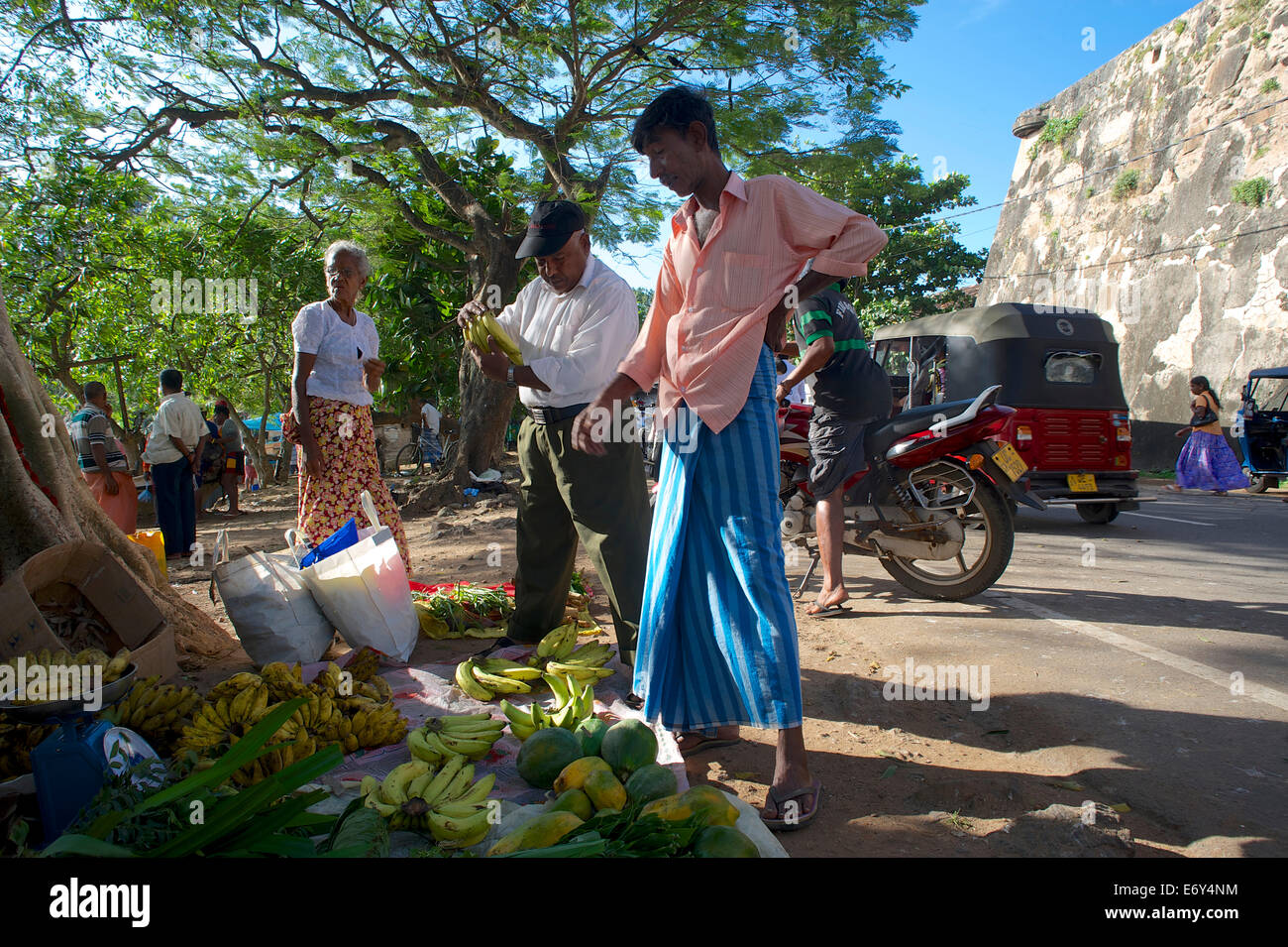 Market stall selling bananas and papayas outside the walls of Galle Fort, UNESCO world heritage, Galle, Southwest coast, Sri Lan Stock Photo