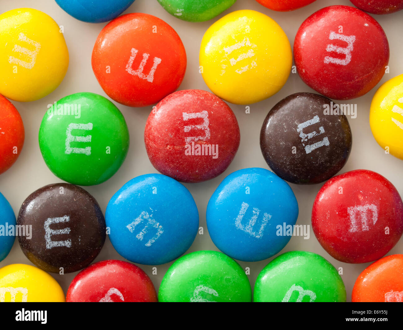 choco M&Ms chocolate brownie - a delicious chocolate brownie topped with  milk chocolate and mini M&M's on white background Stock Photo - Alamy