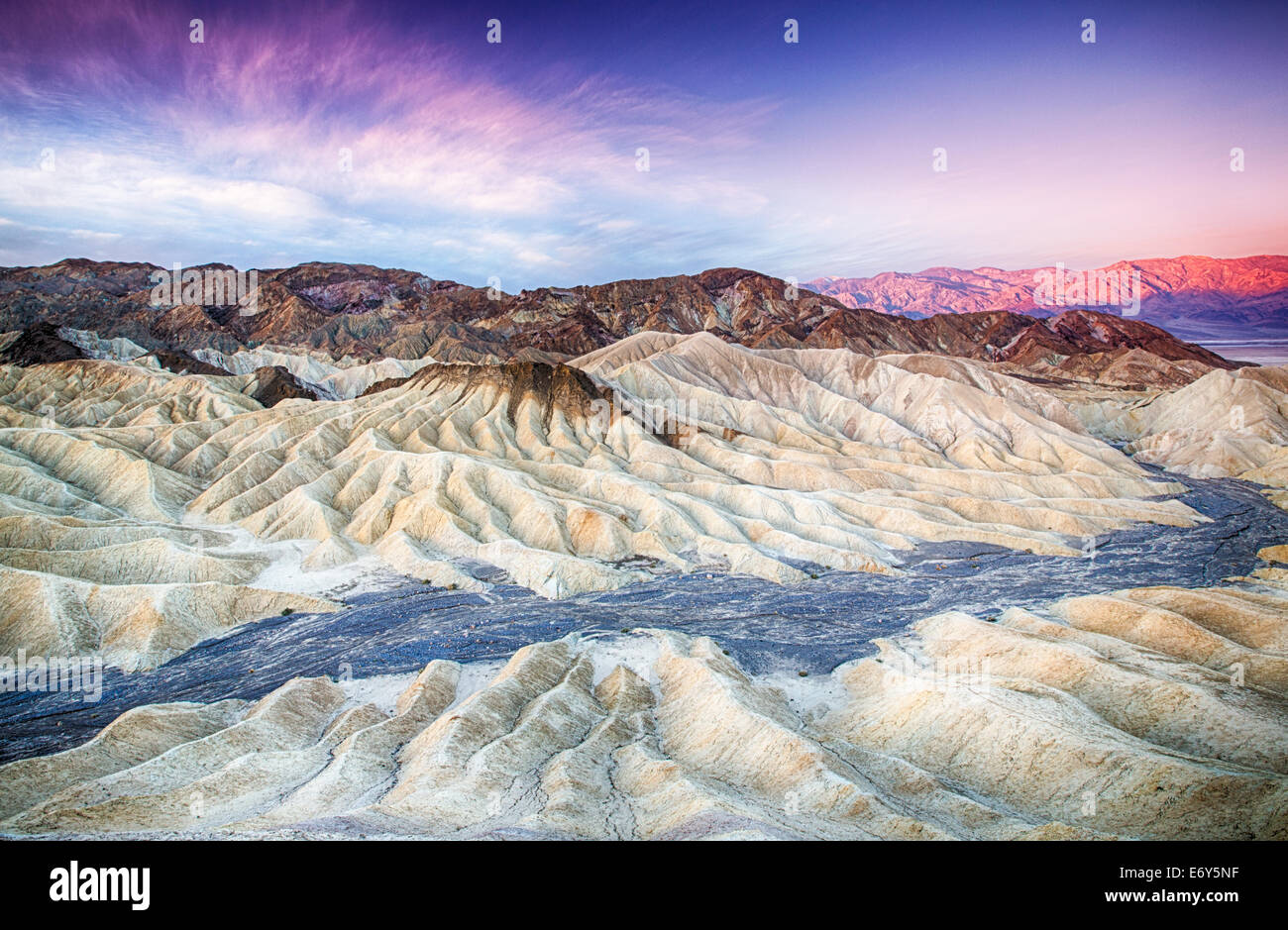 The sun rises over Zabriskie Point in Death Valley National Park, California, USA Stock Photo