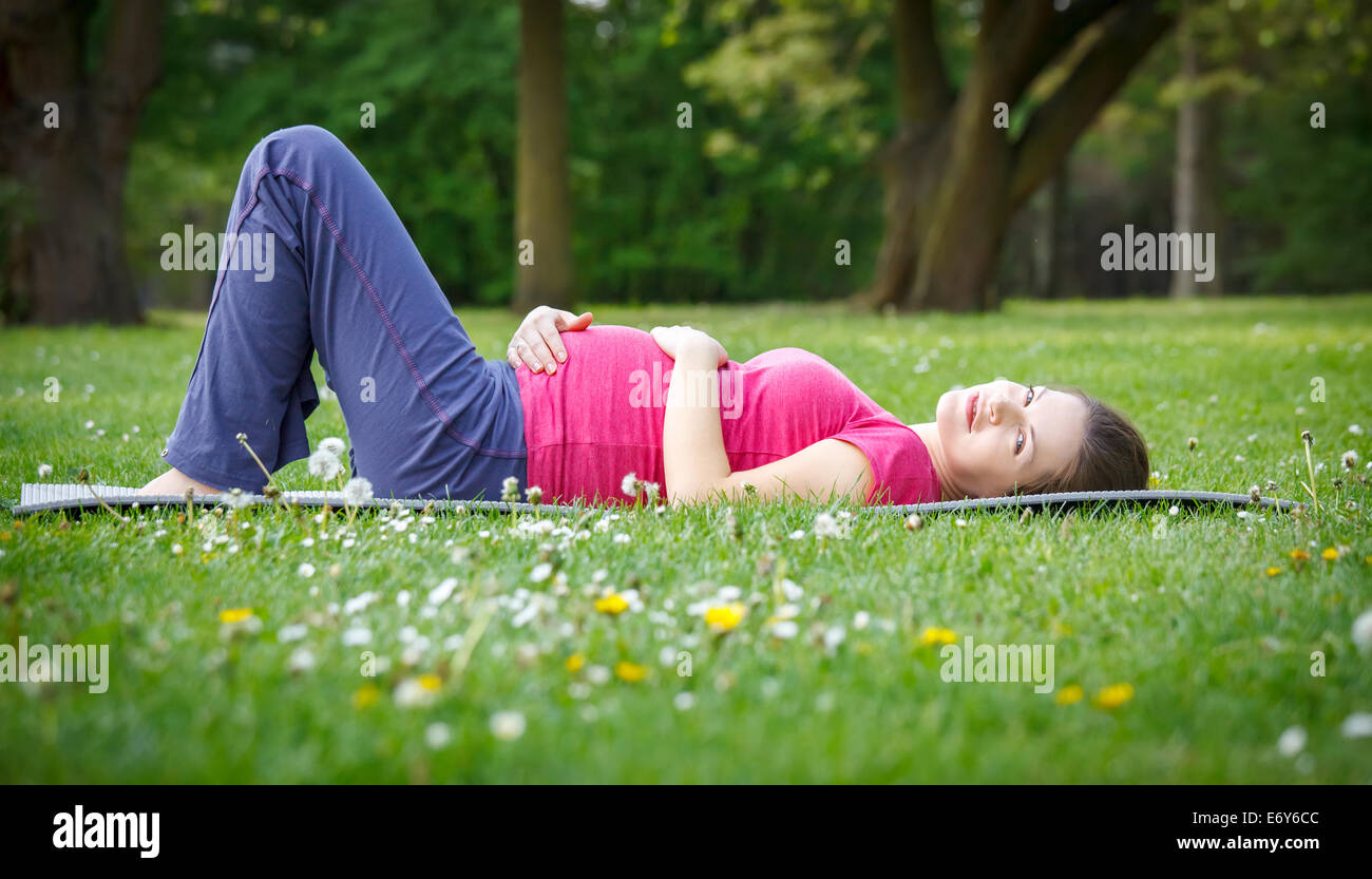 Beautiful pregnant woman in the park Stock Photo - Alamy