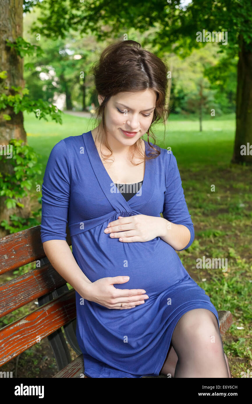Beautiful pregnant woman in the park Stock Photo - Alamy