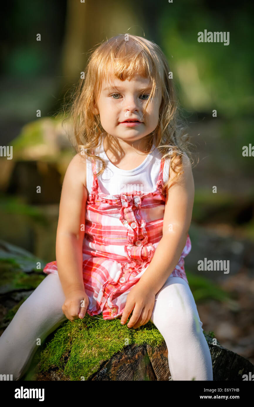 Little girl in the forest Stock Photo Alamy