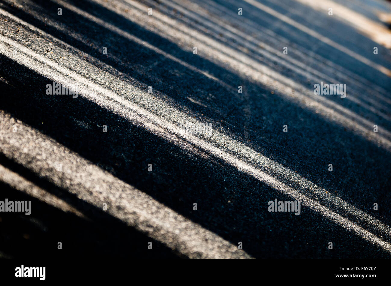 Abstract background of tan lines on black background Stock Photo