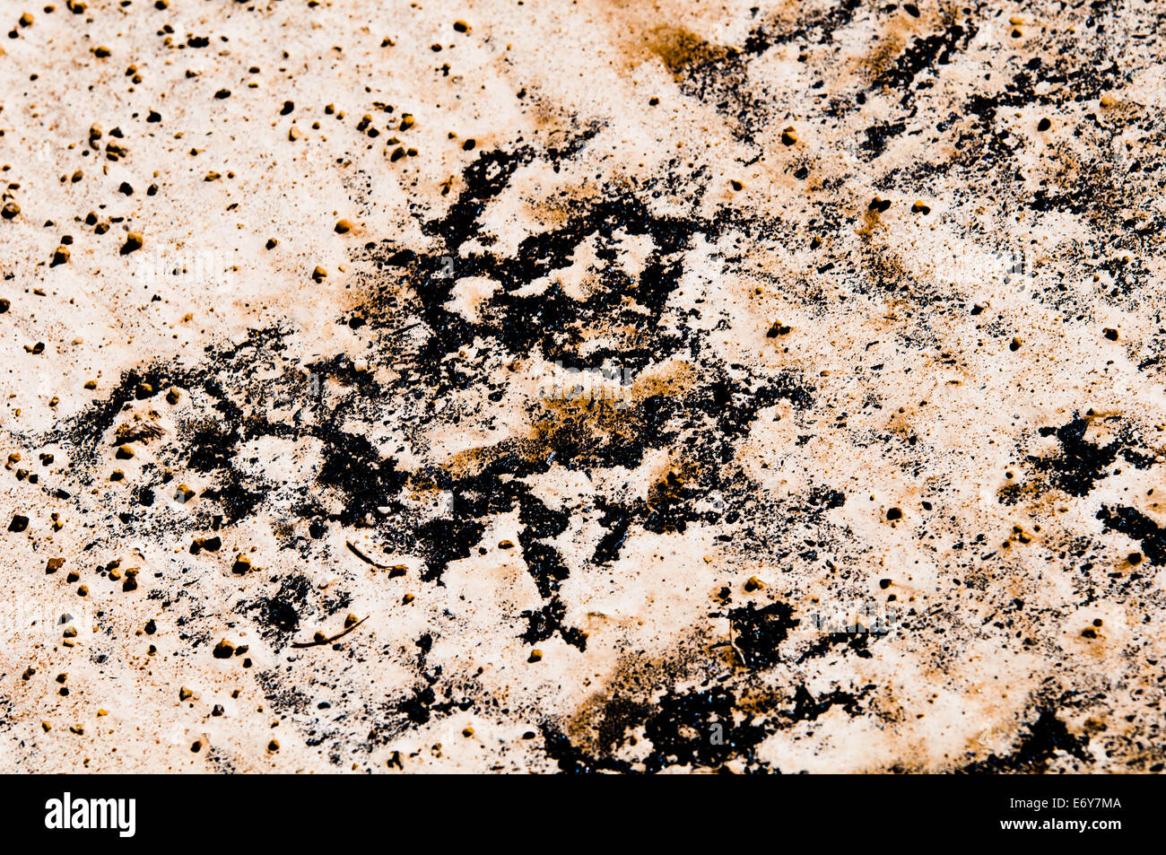 Abstract textured background of sand, rocks, and asphalt Stock Photo