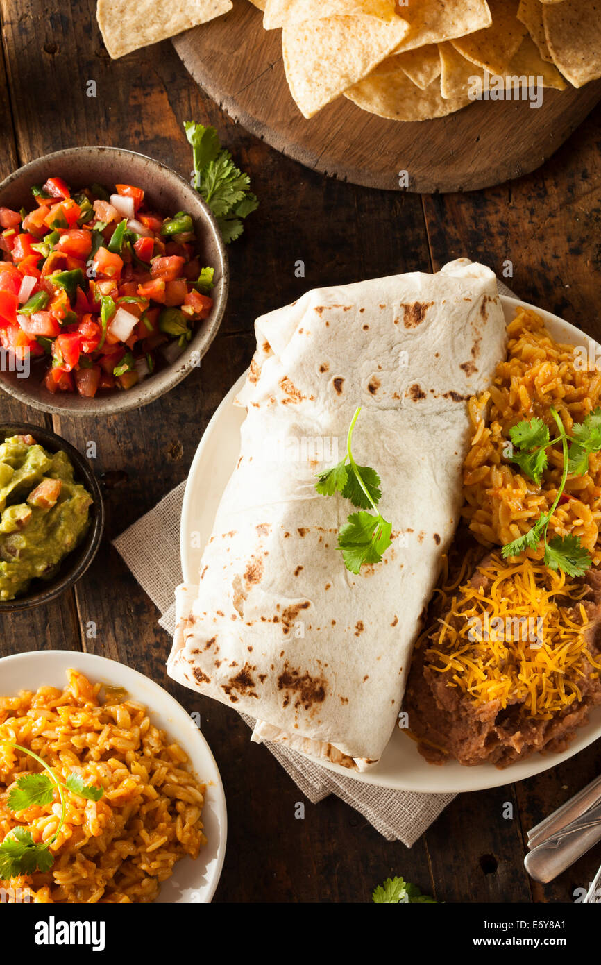 Homemade Giant Beef Burrito with Lettuce Salsa and Rice Stock Photo - Alamy
