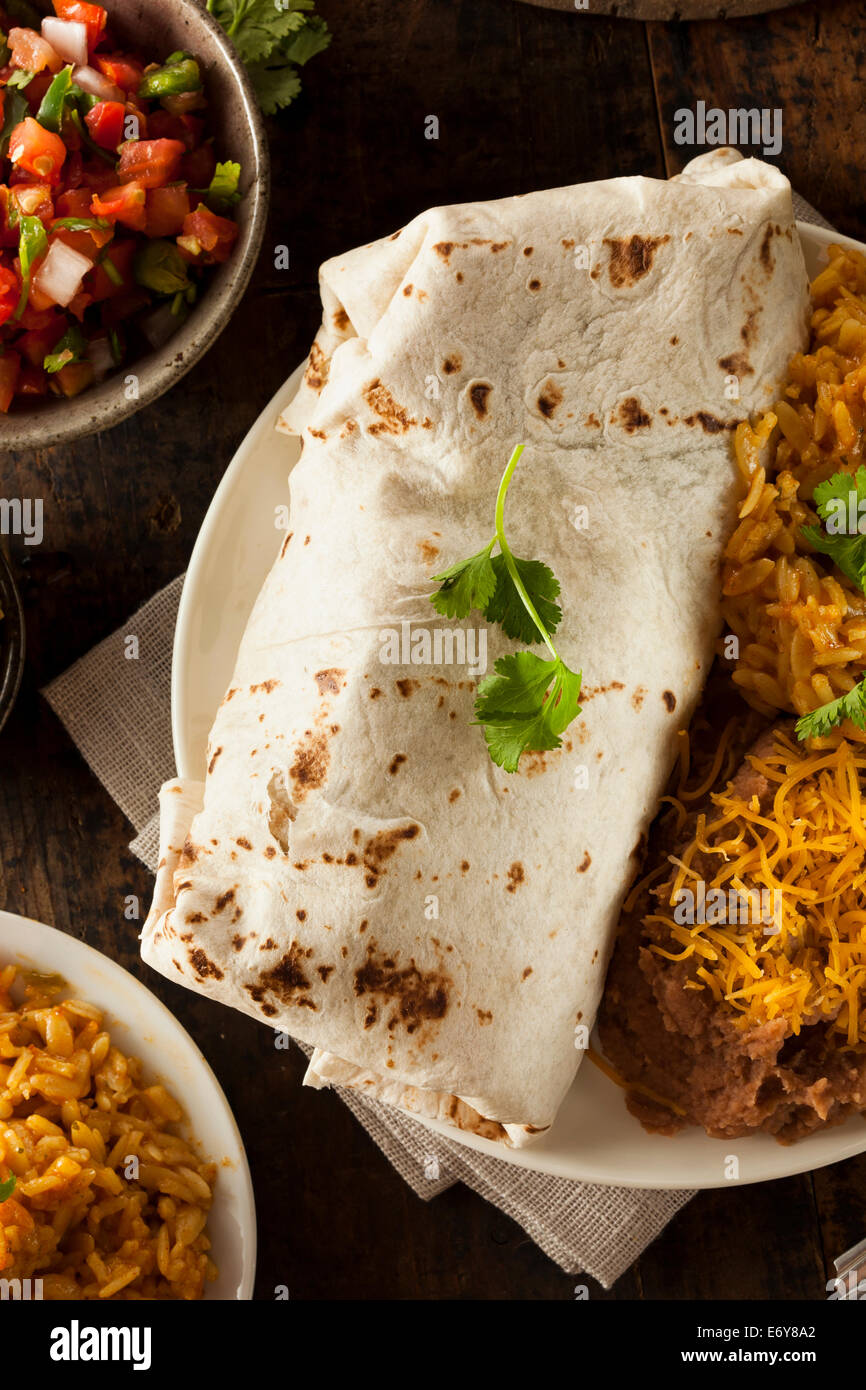 Homemade Giant Beef Burrito with Lettuce Salsa and Rice Stock Photo - Alamy