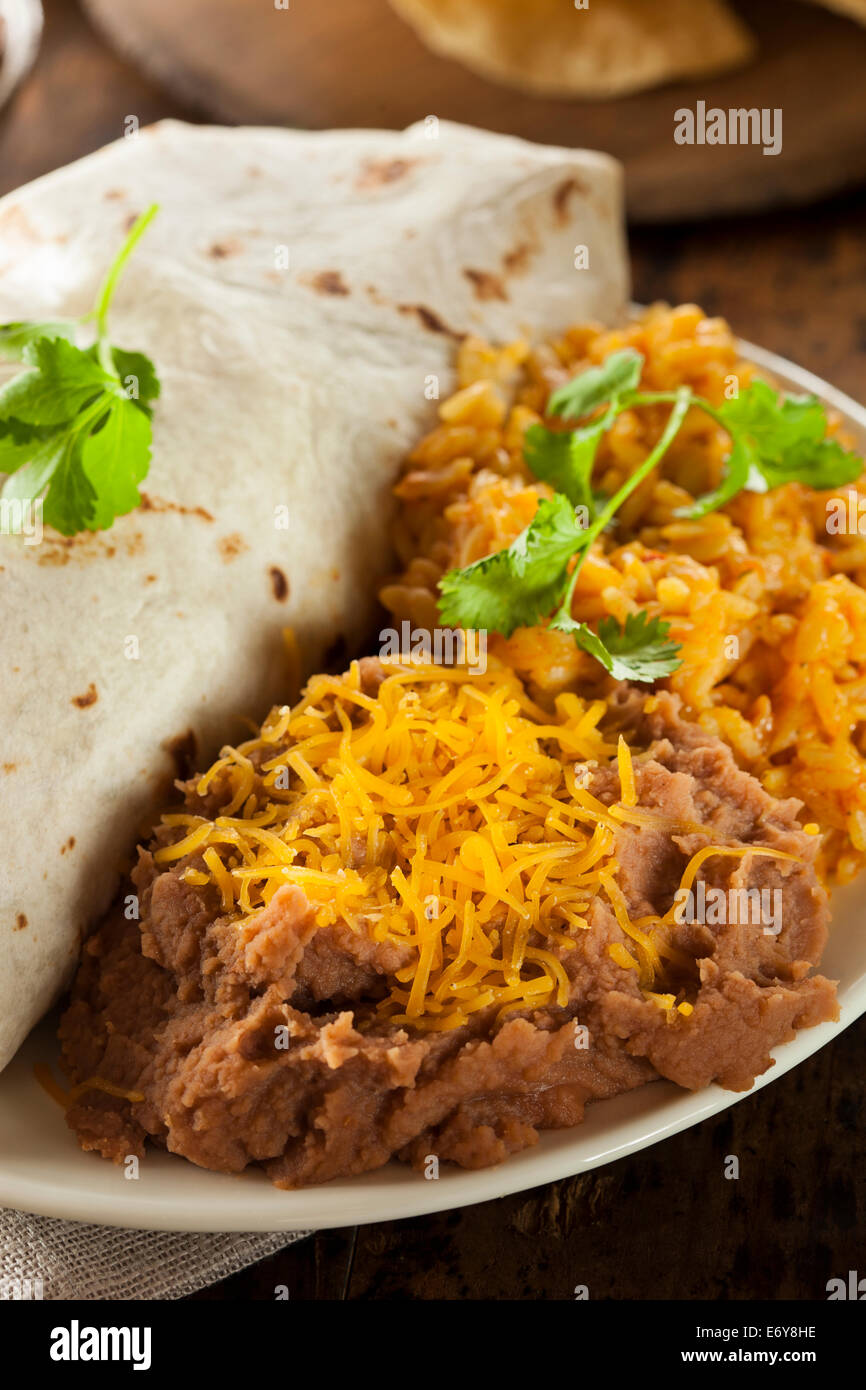 Homemade Refried Beans with Cheese and Rice Stock Photo Alamy
