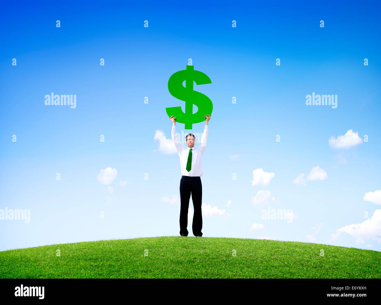 Business Man Outdoors Holding a Dollar Sign Stock Photo - Alamy