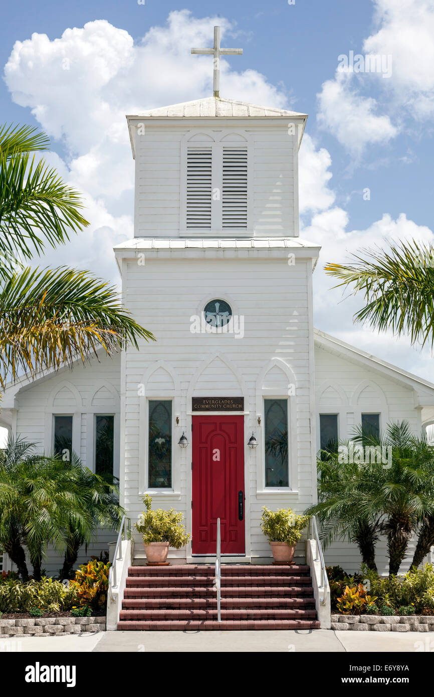Red Front Entry Door And Steeple Of The Community Church On
