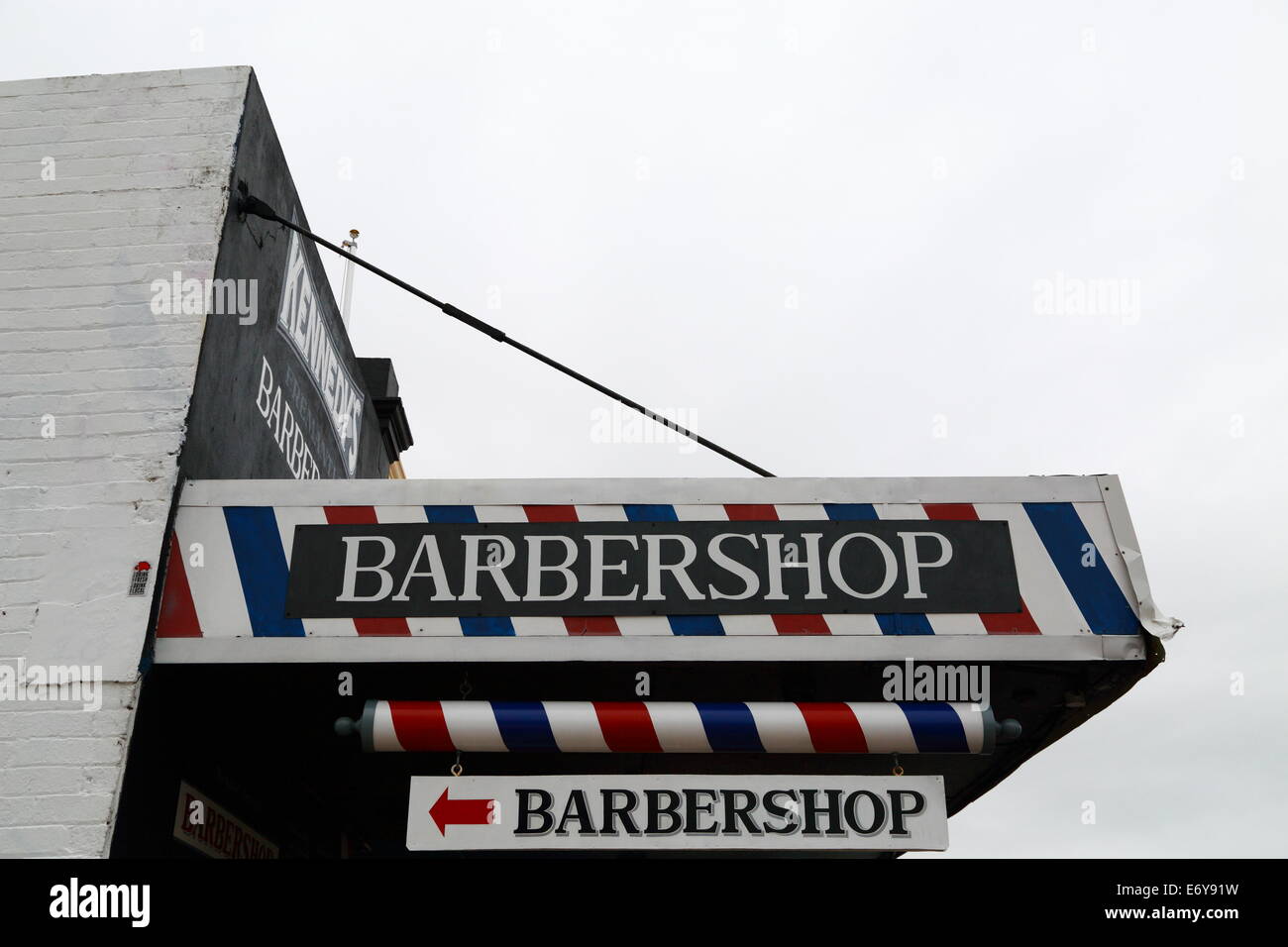 A barbershop with accompanying striped pole and paintwork in Fremantle, Western Australia. Stock Photo