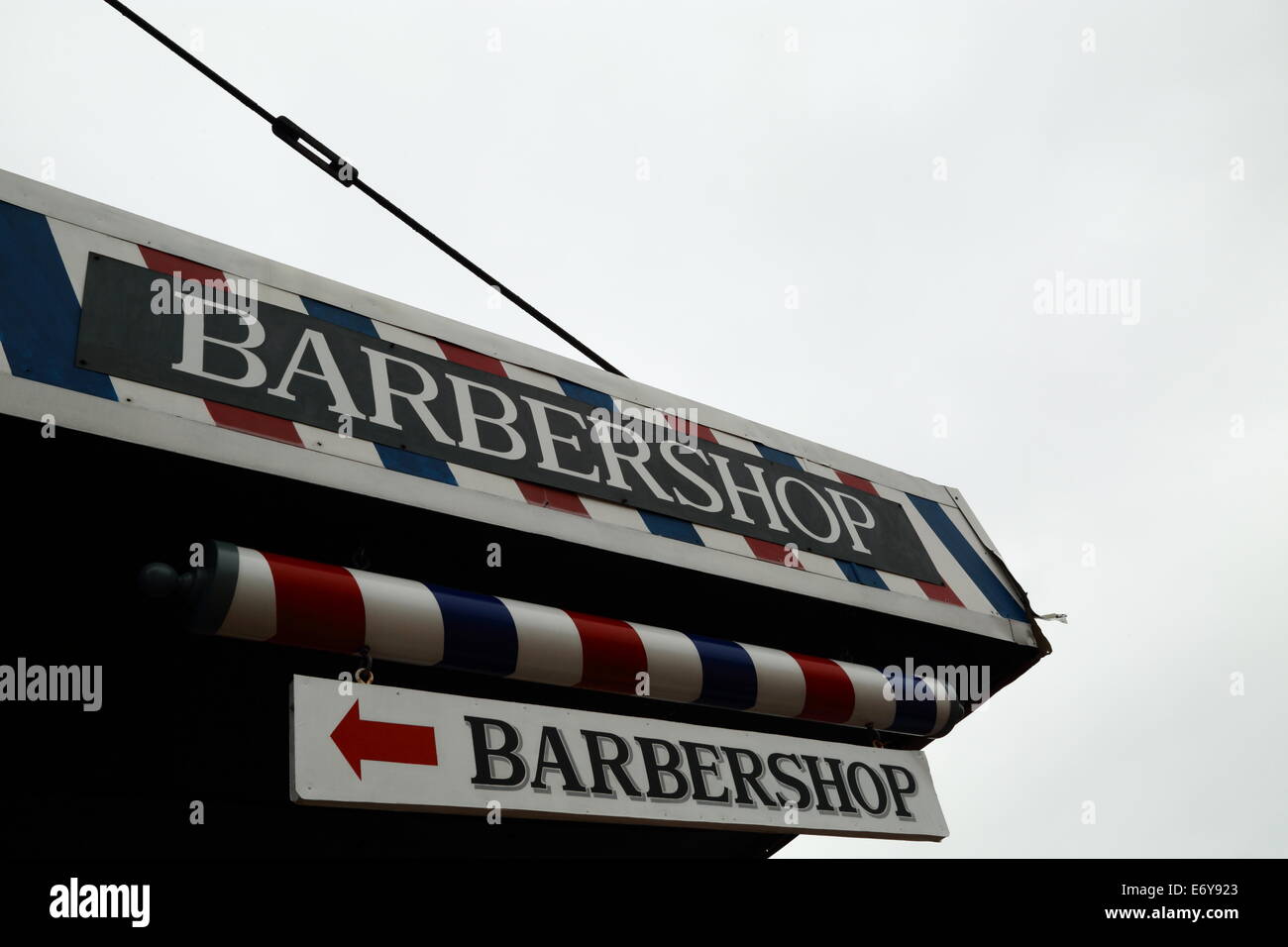 A barbershop with accompanying striped pole and paintwork in Fremantle, Western Australia. Stock Photo