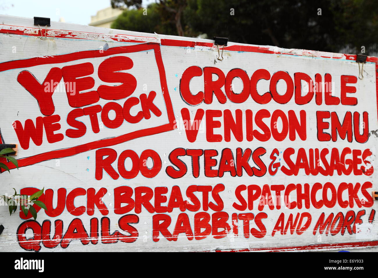 A sign out front of a butcher shop advertises the availability of crocodile, venison, emu etc. in Fremantle, Western Australia. Stock Photo