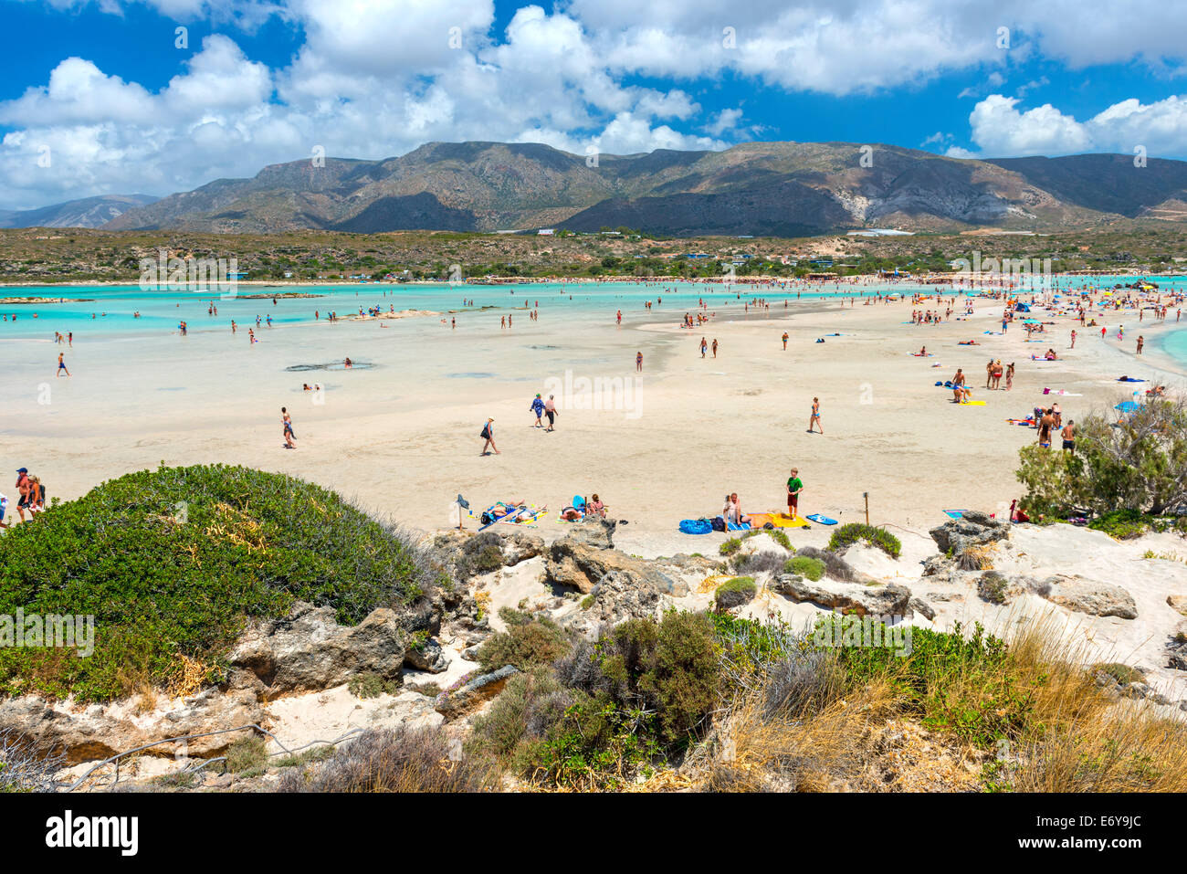 ELAFONISSI, CRETE, GREECE - July 24, 2014: Tourists At The Famous Pink Sand Beach Of Elafonissi ( Elafonisi ) In Crete, Greece Stock Photo