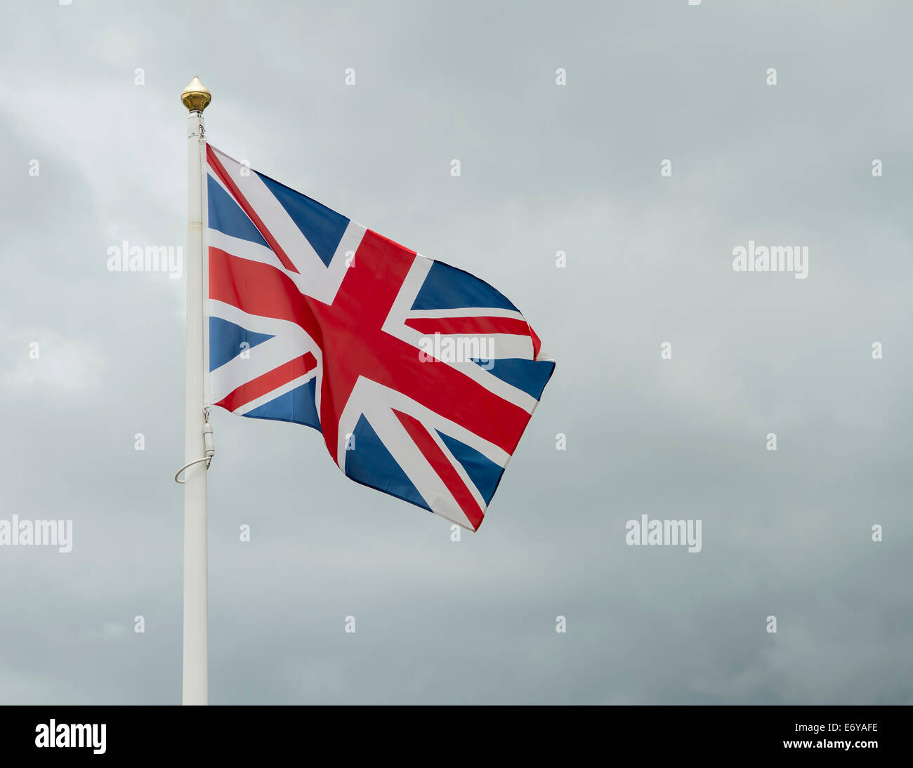 Great Britain flag against stormy sky Stock Photo