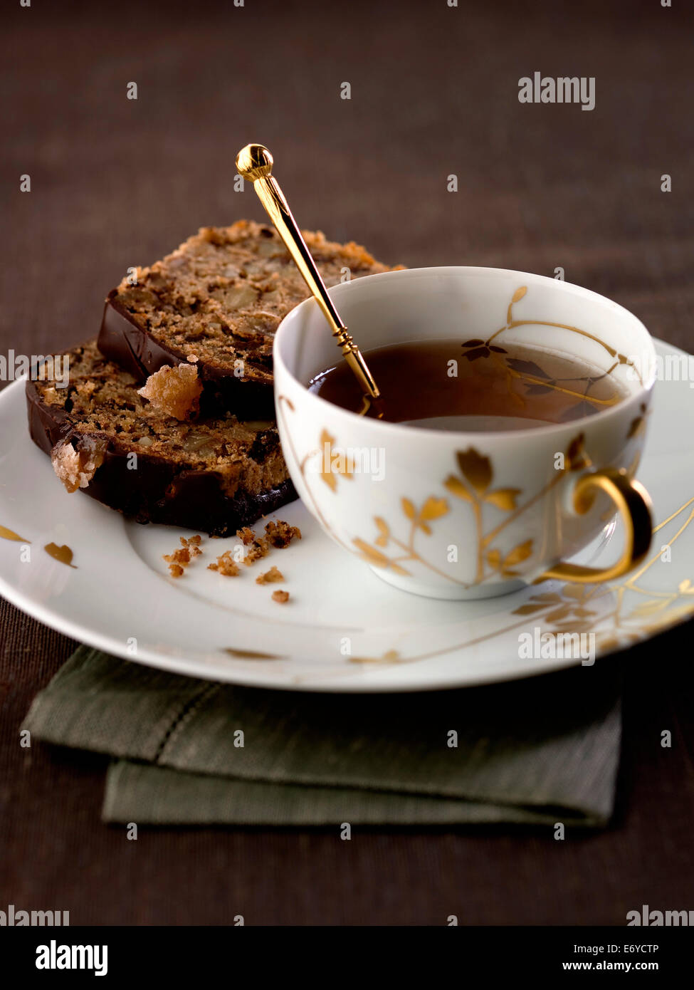 Spicy candied chestnut cake and a cup of tea Stock Photo