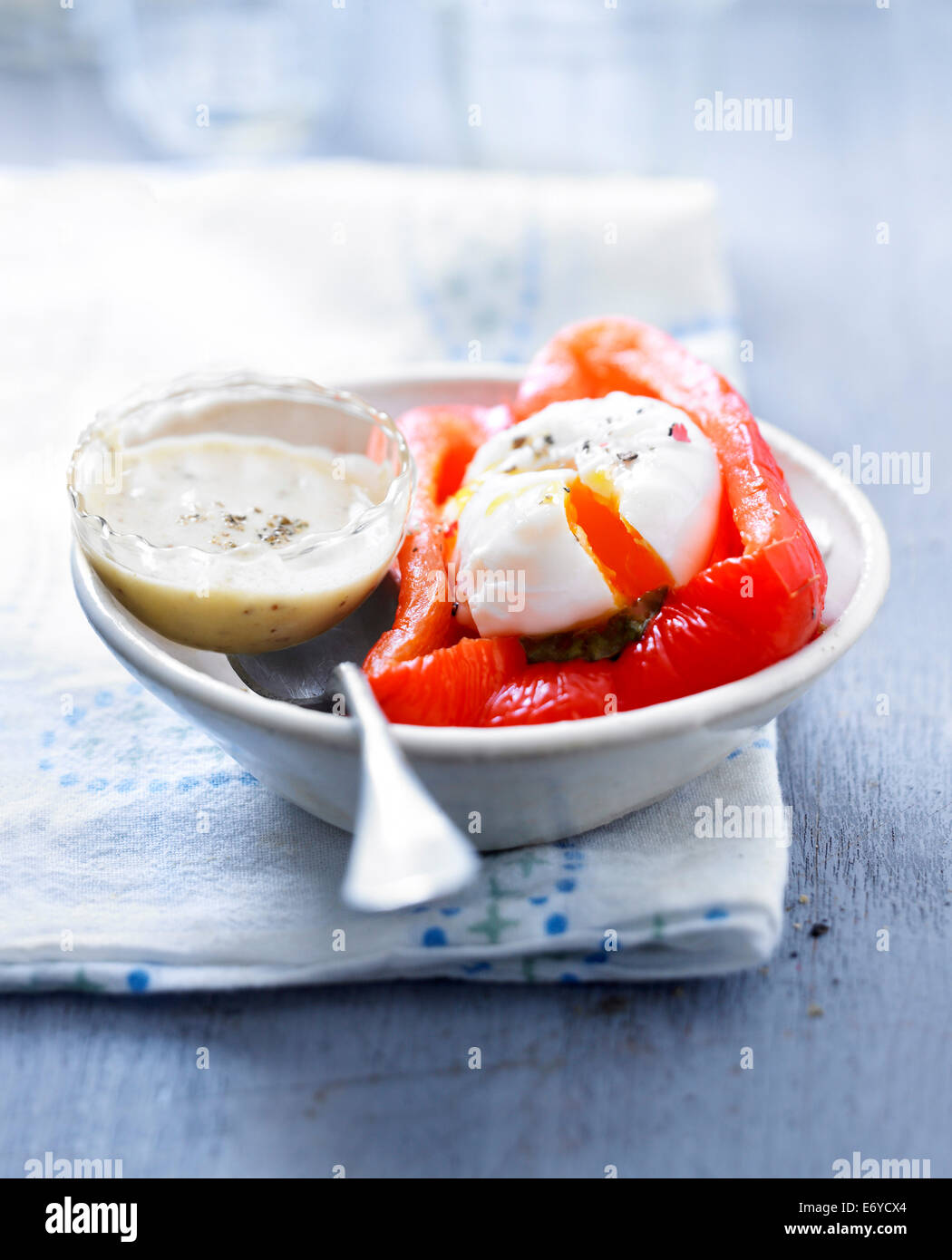 Soft-boiled egg in half a red bell pepper Stock Photo