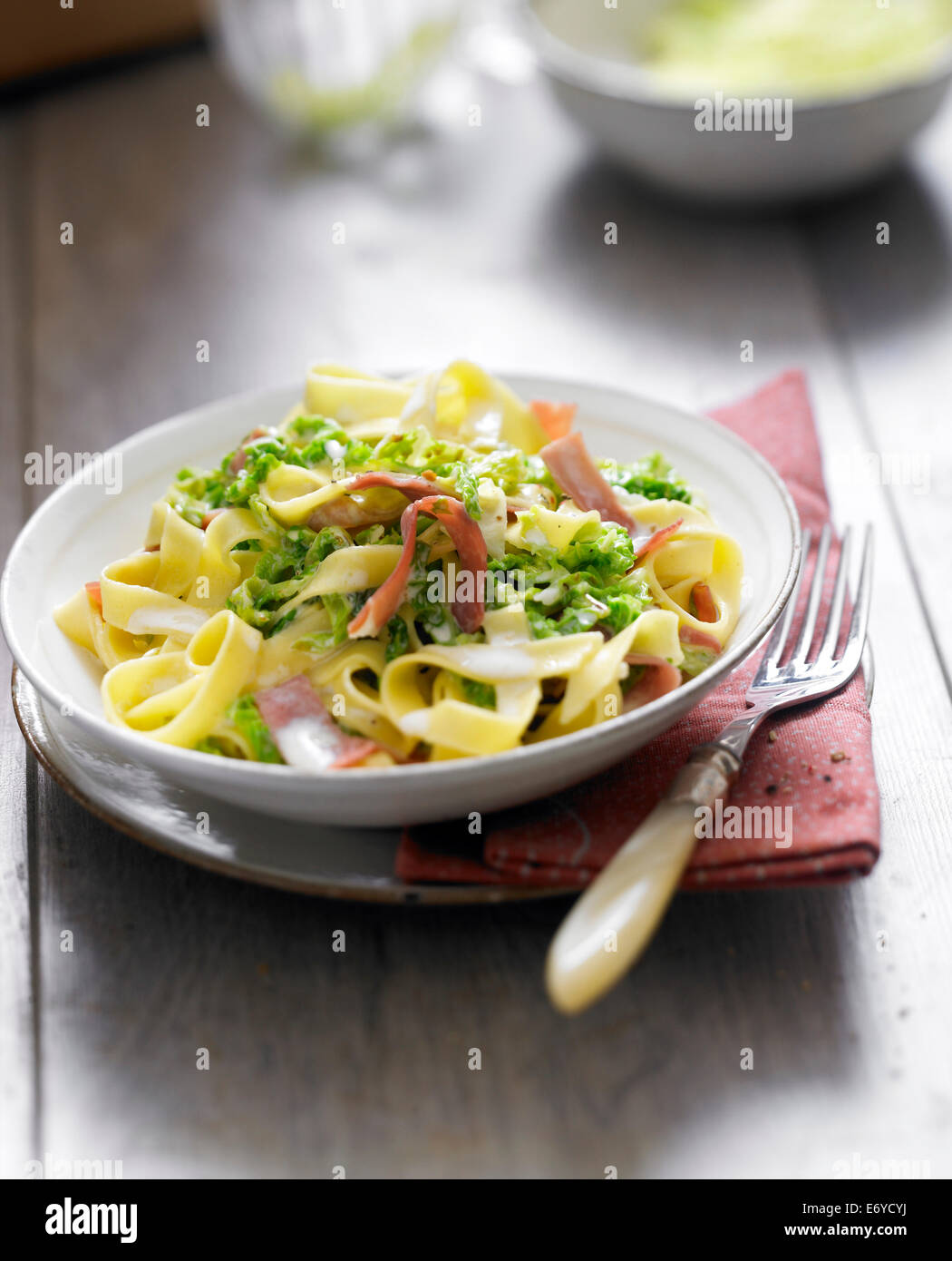 Tagliatelles with Parma ham and cabbages Stock Photo