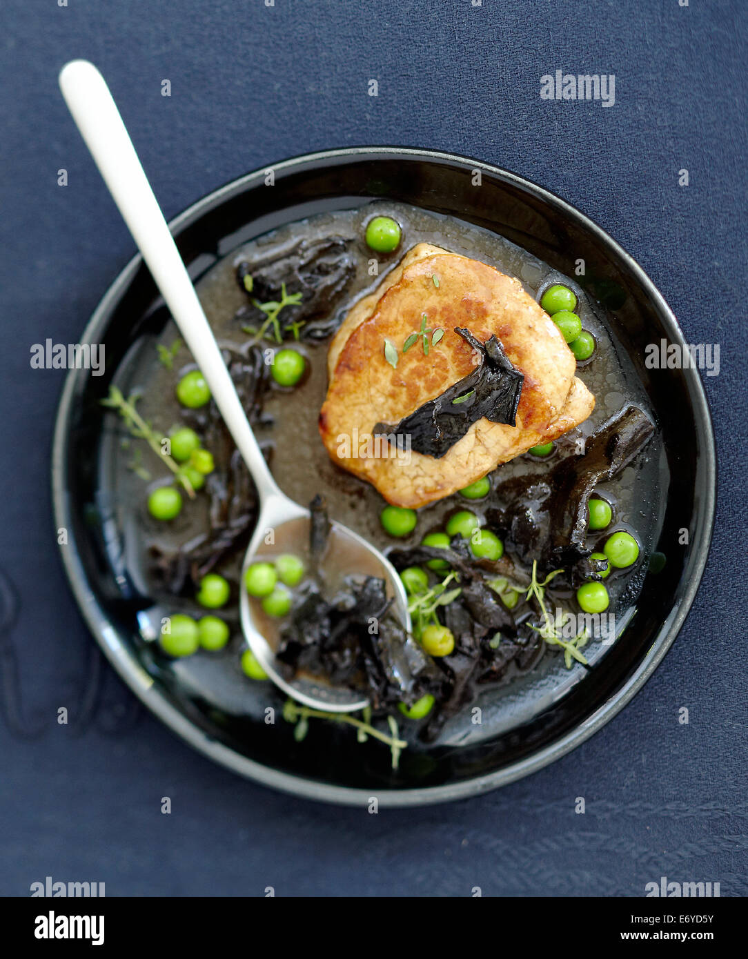 Veal Grenadin with black trumpet mushrooms,peas and thyme gravy Stock