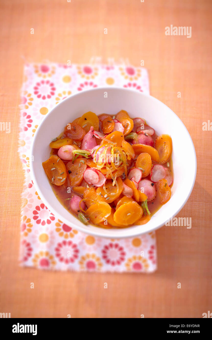 Sweet and salty carrot and radishes in grape fruit syrup salad Stock Photo