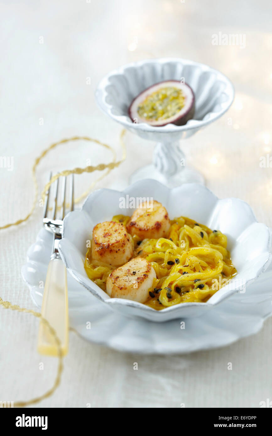 Stewed chicory with scallops and passion fruit Stock Photo