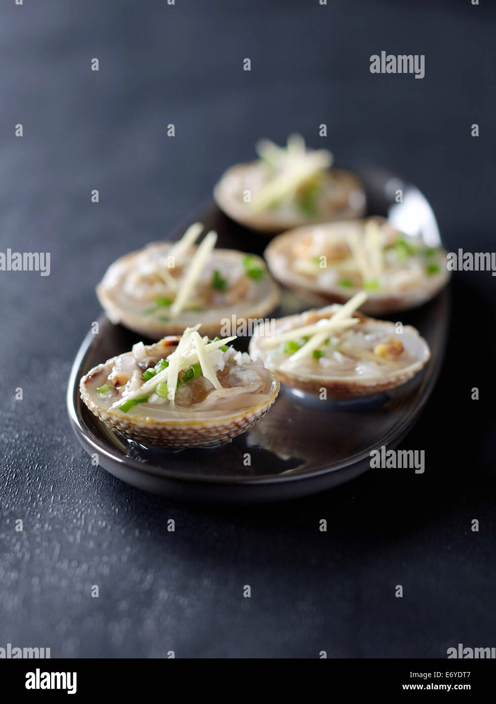 Dog cockle shellfish marinated with ginger and chives Stock Photo Alamy