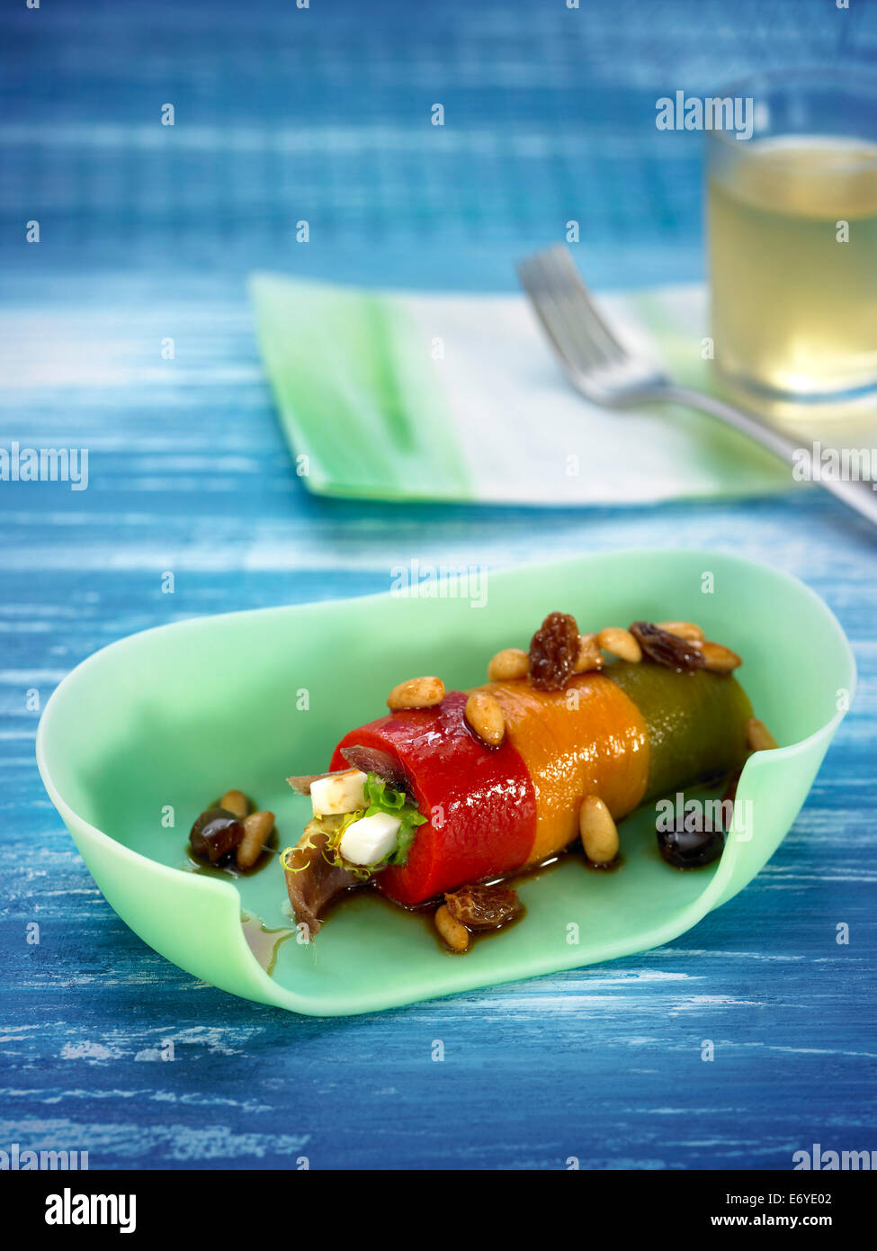 Rolled bell peppers stuffed with dried fruit and cheese Stock Photo