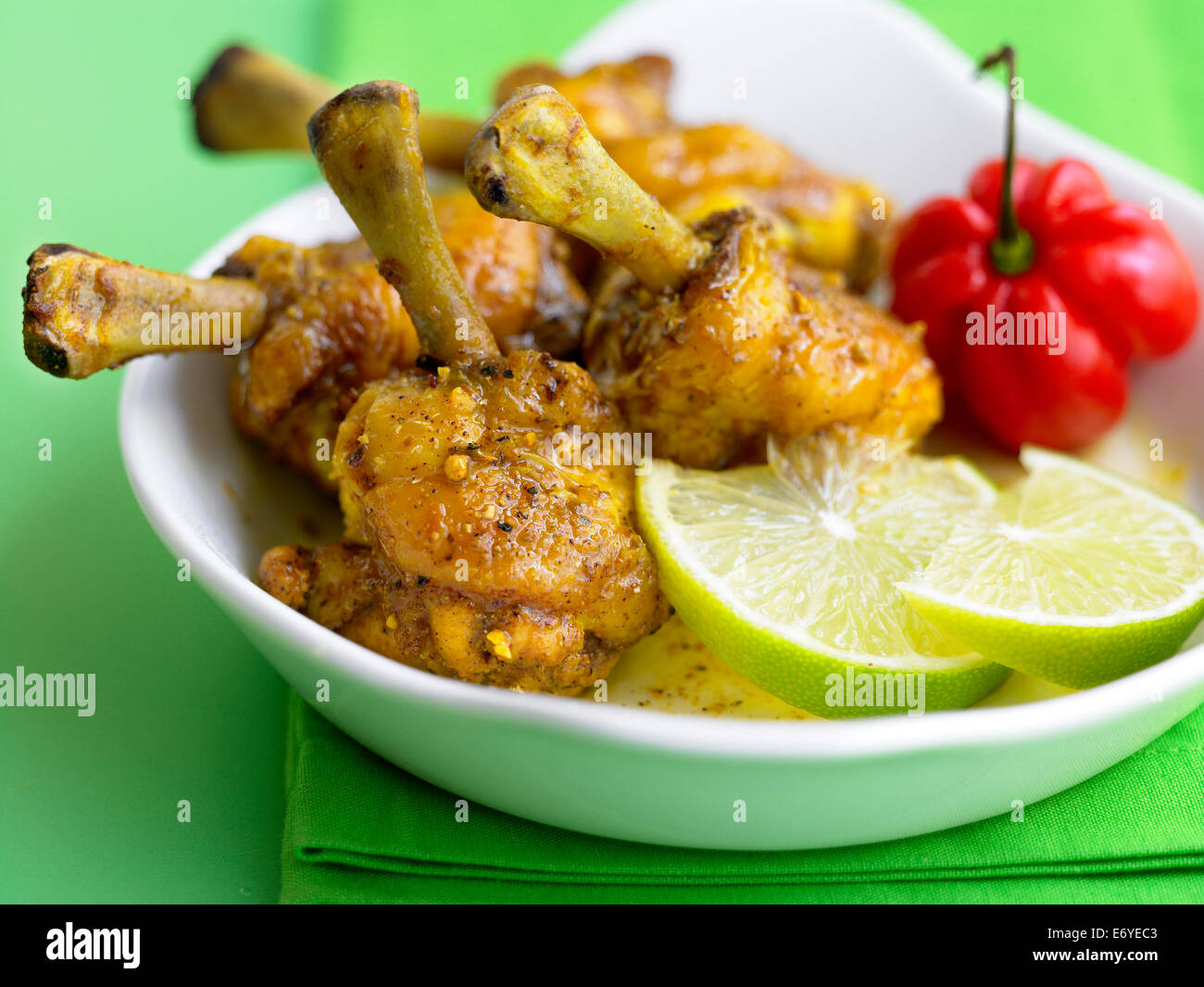 Curried chicken drumsticks Stock Photo - Alamy