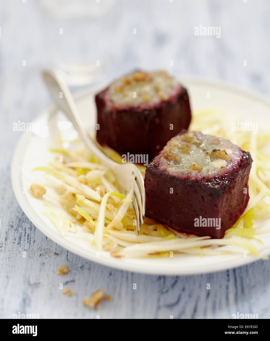 Chicory salad with beetroot cubes grilled with roquefort Stock Photo