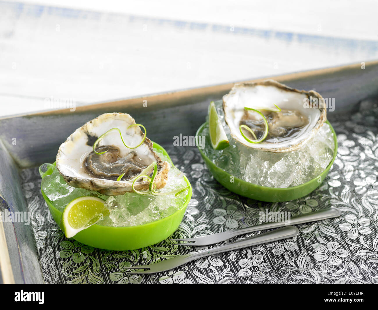 Oysters with lime zests Stock Photo