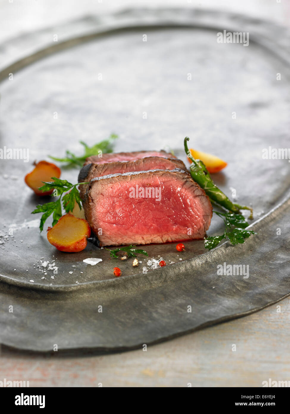 beef with red pepper and herbs Stock Photo