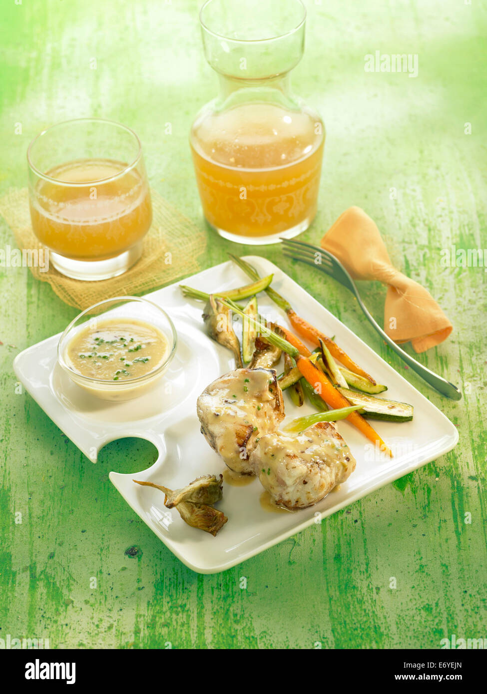 Monkfish,almond sauce and grilled vegetables Stock Photo