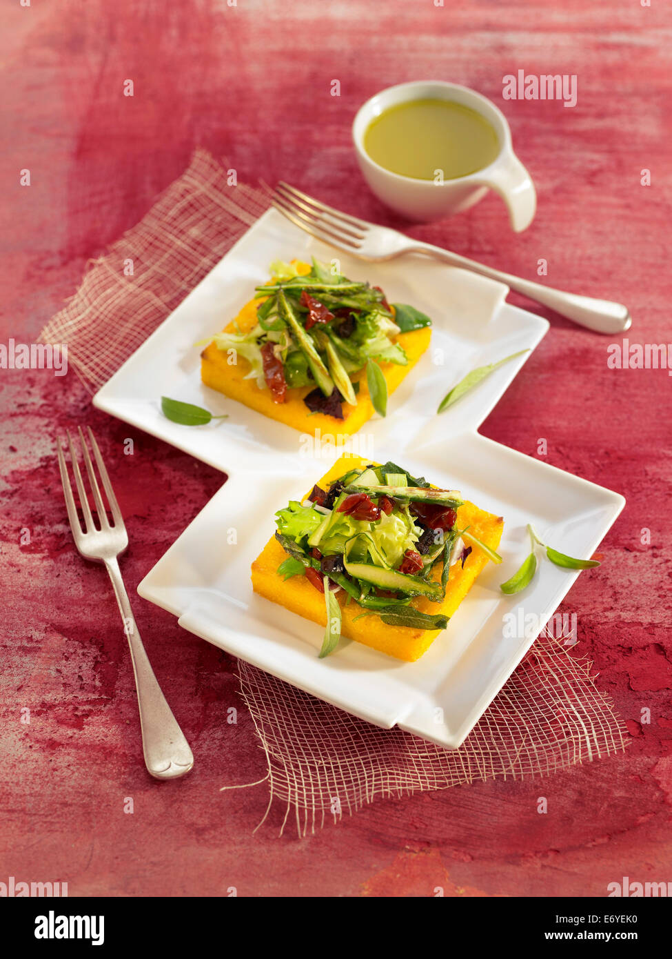 Polenta and salad Stock Photo