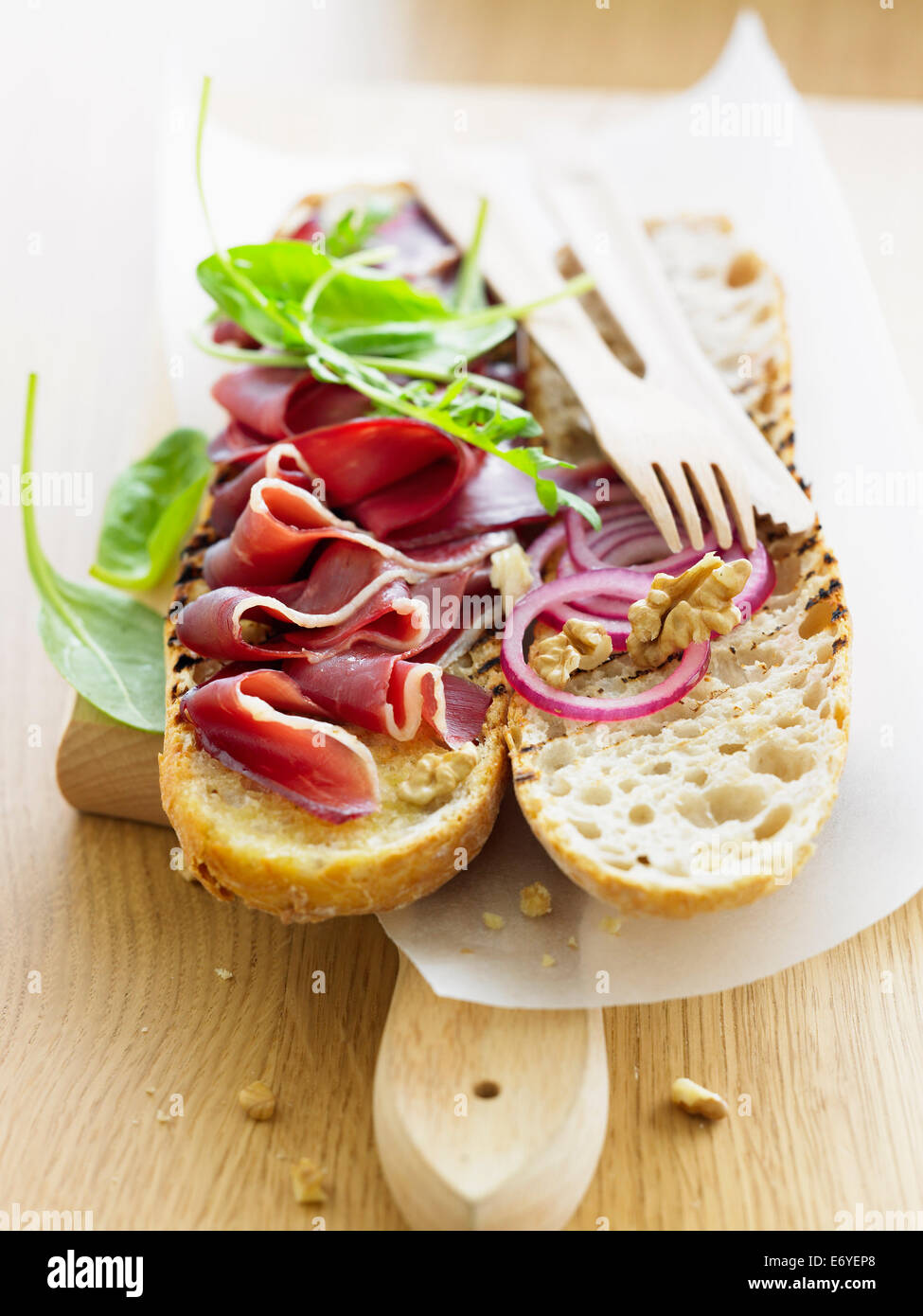 Thinly sliced duck magret on toast Stock Photo