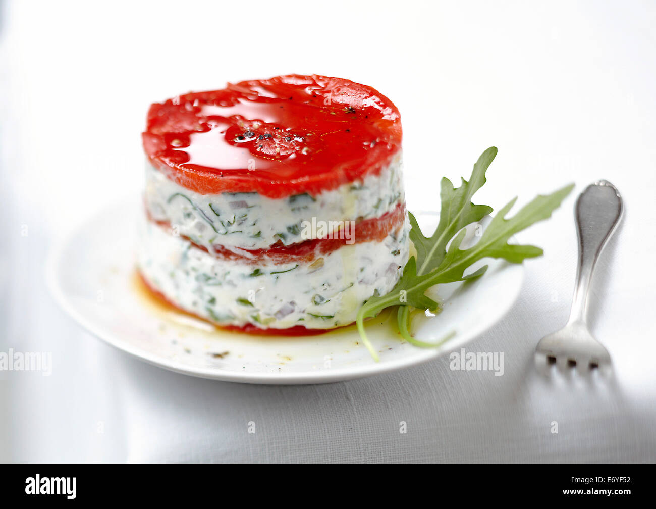 Fromage frais with herbs and red pepper timbale Stock Photo