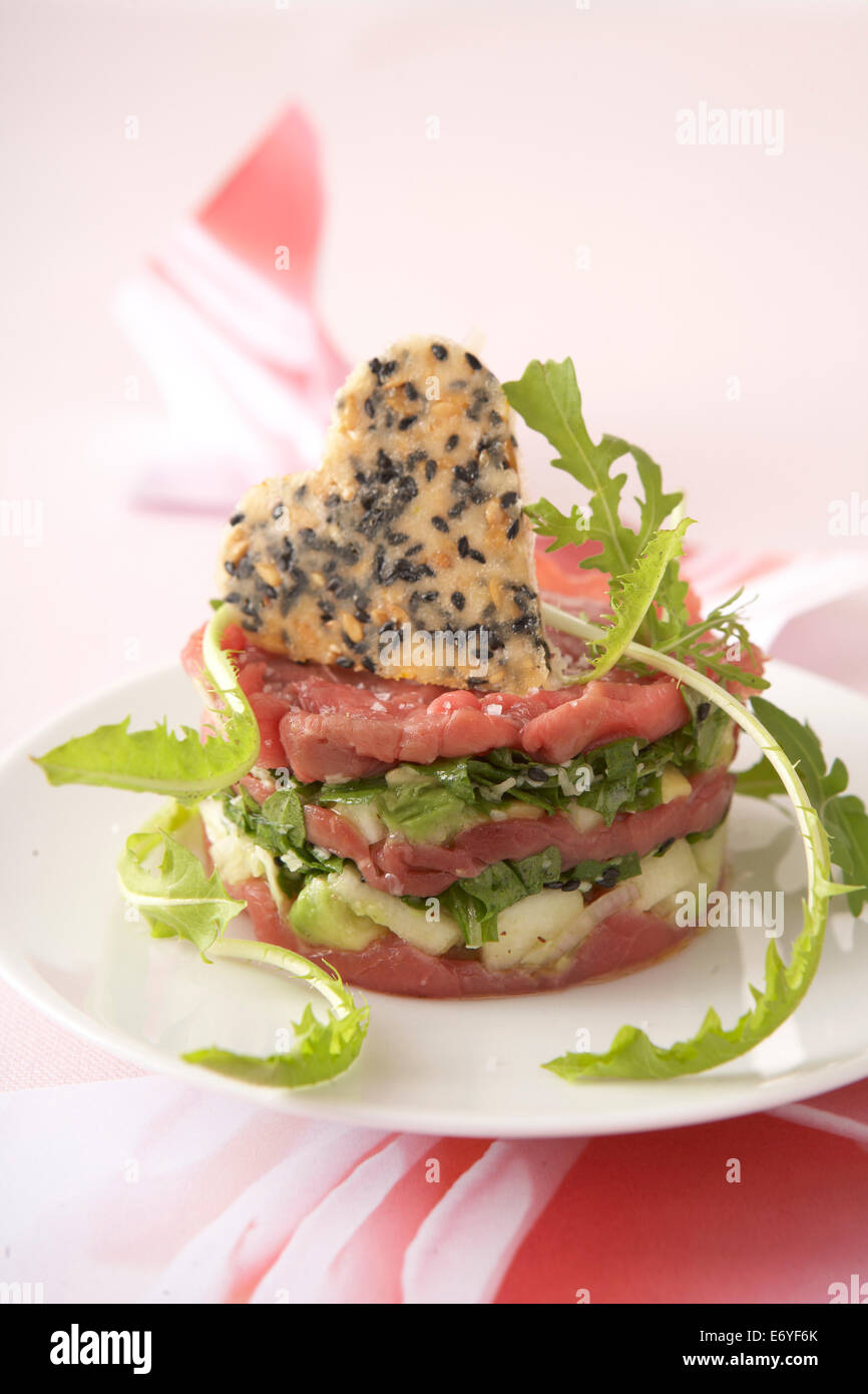 Beef carpaccio,Granny Smith and palm heart mille-feuille Stock Photo